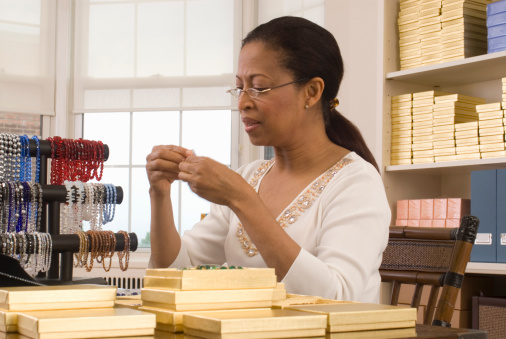 woman making jewlery